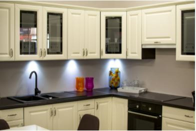 White painted kitchen cabinets with black countertop