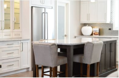 White kitchen cabinets with white countertop island